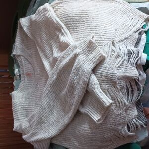 Tan V neck sweater with distressed hem